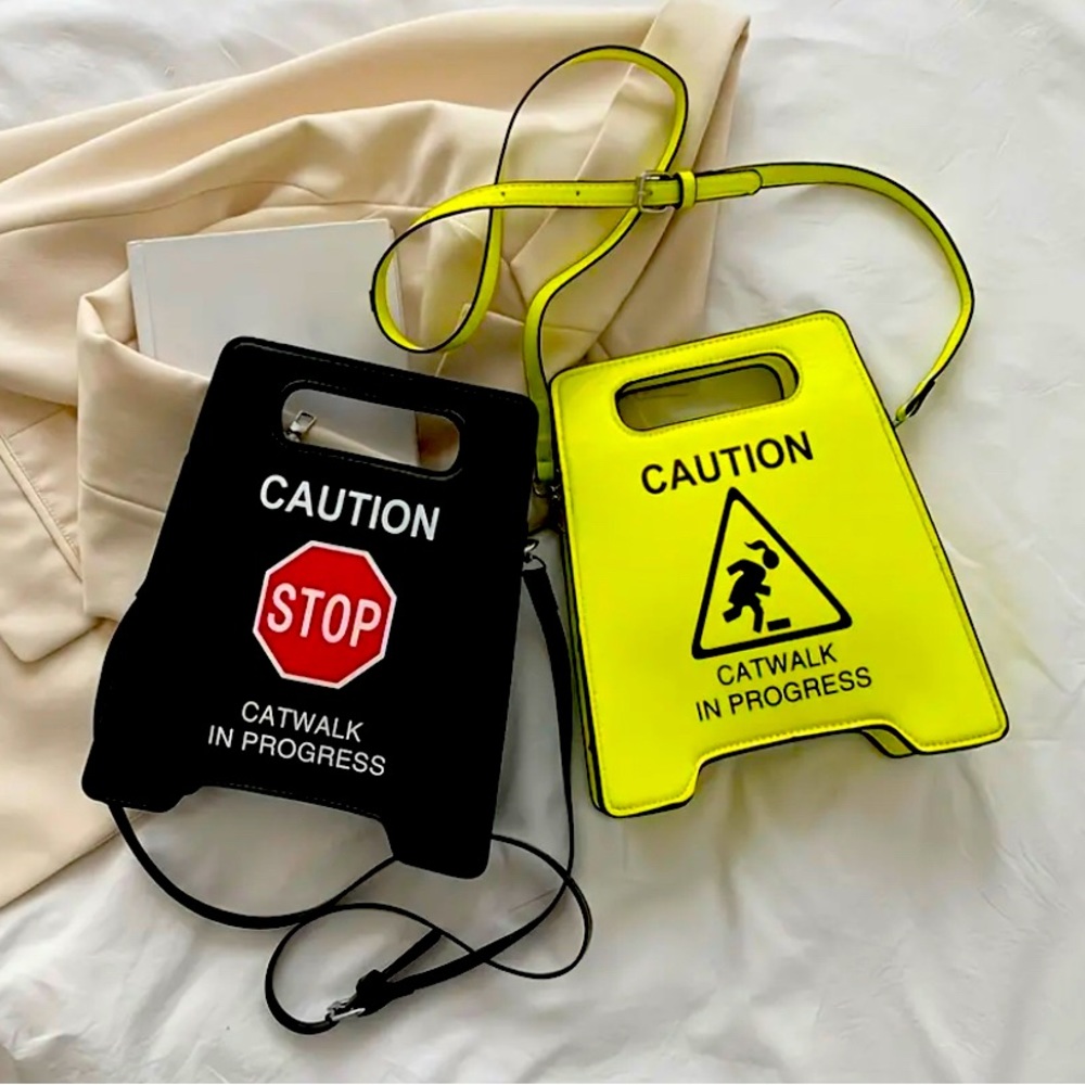 Shop our Caution When Wet purse
